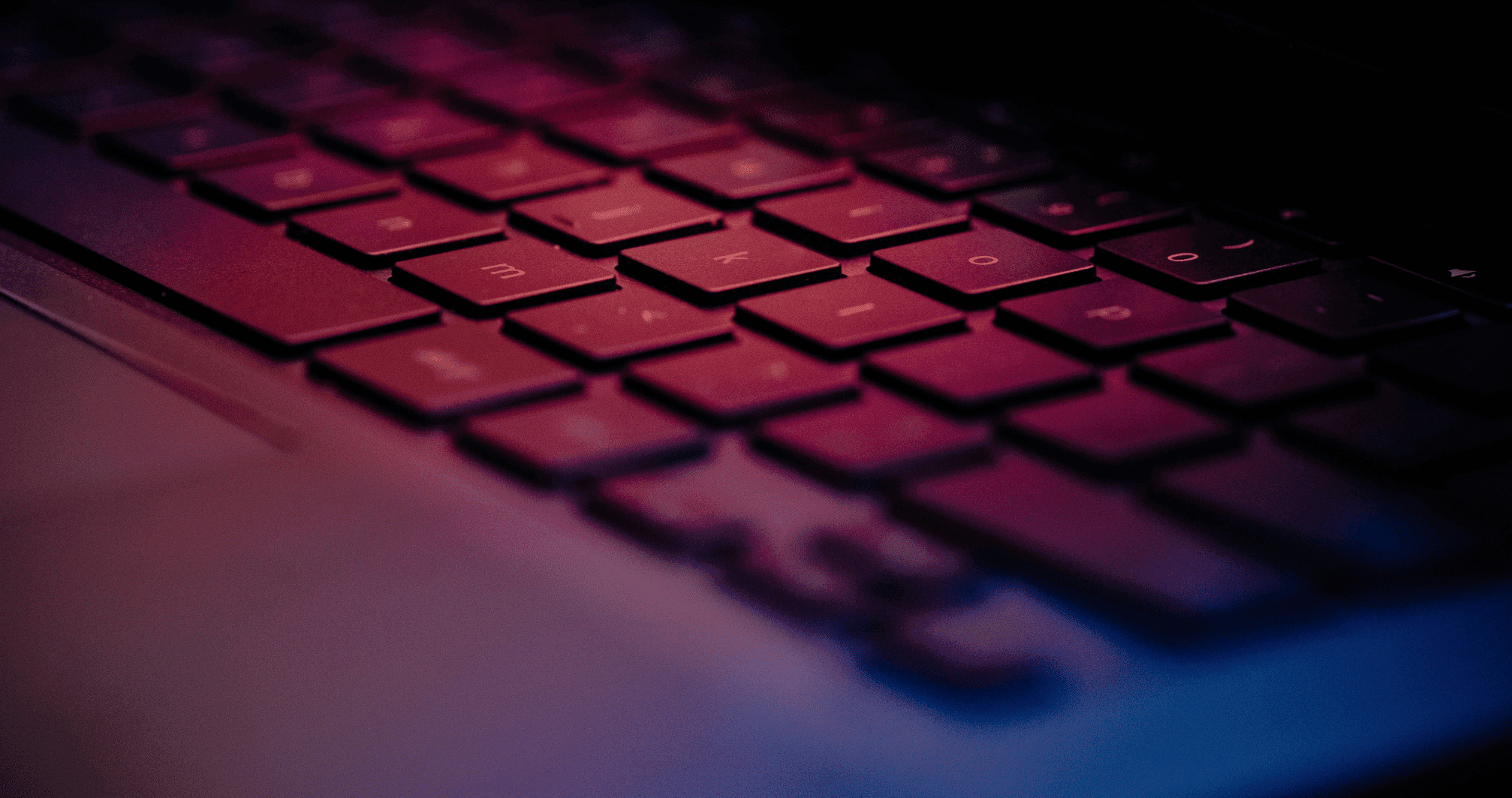 Technology keyboard illuminated in red and blue